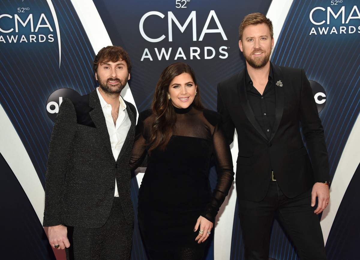 In this Nov. 14, 2018 file photo, Dave Haywood, from left, Hillary Scott and Charles Kelley, of Lady A, formerly Lady Antebellum, arrive at the 52nd annual CMA Awards in Nashville, Tenn.