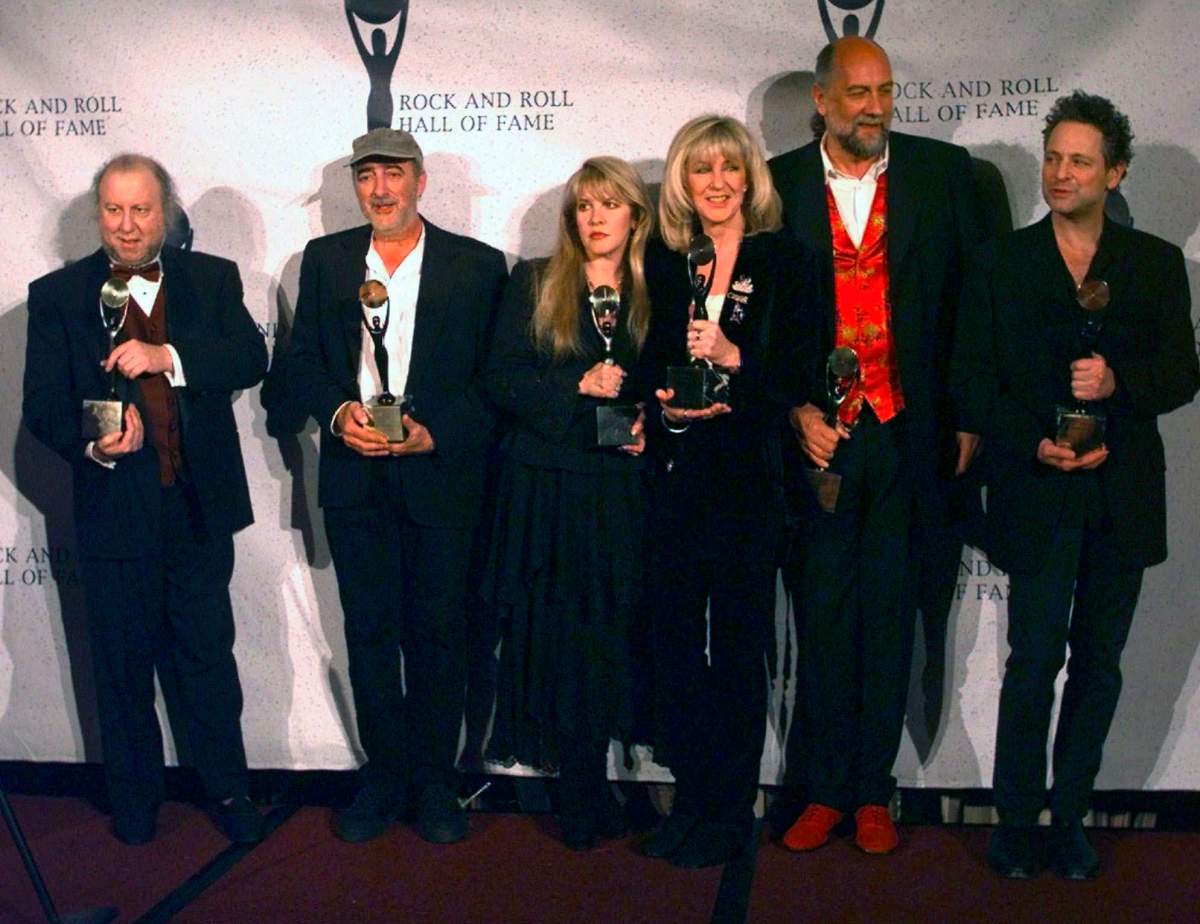 In this file photo dated Monday, Jan. 12, 1998, Members of Fleetwood Mac hold their awards after the group was inducted into the Rock and Roll Hall of Fame, in New York. From left, are: Peter Green; John McVie; Stevie Nicks; Christine McVie; Mick Fleetwood; and Lindsey Buckingham.