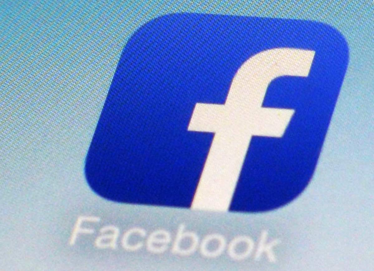 FILE - This Feb. 19, 2014, file photo, shows a Facebook app icon on a smartphone in New York.