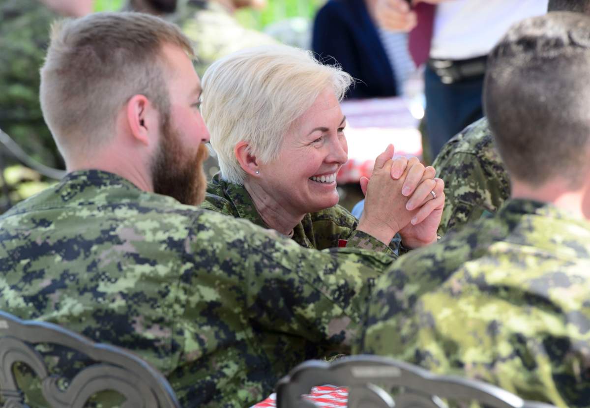 Brigadier-General Jennie Carignan of the Canadian Armed Forces joins soldiers during a lunch with Prime Minister Justin Trudeau and Secretary-General of the North Atlantic Treaty Organization (NATO) Jens Stoltenberg at Canadian Forces Base Petawawa, Ont. on Monday, July 15, 2019.