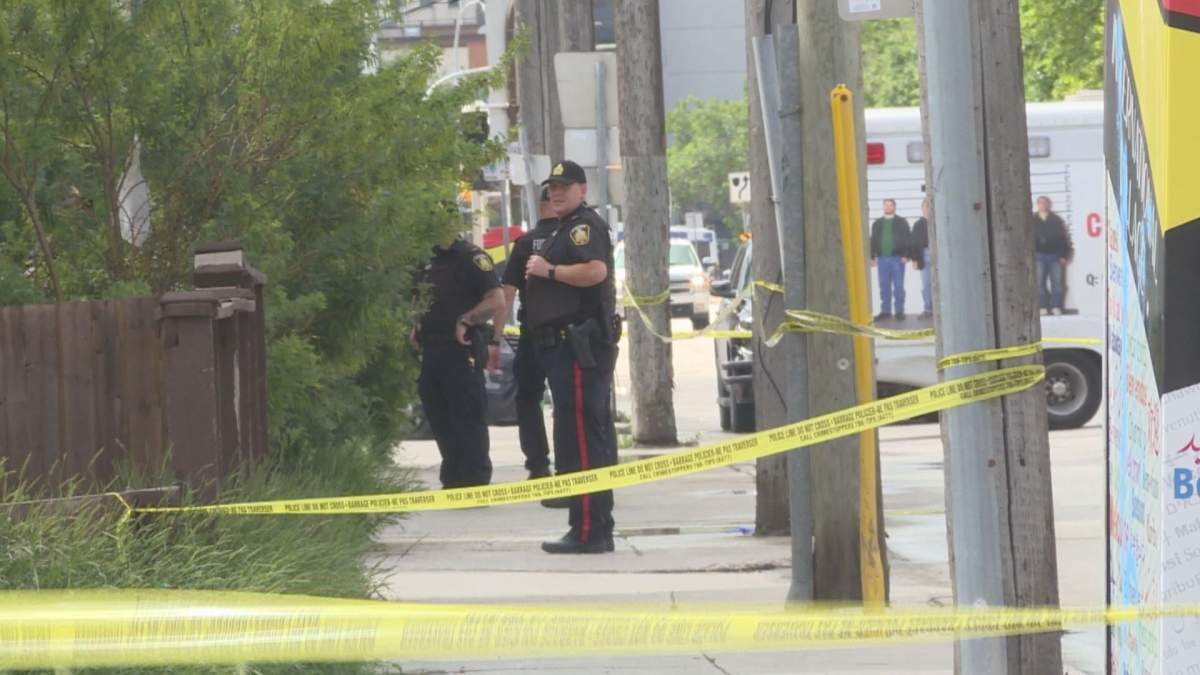 Police on scene after a man was shot and later hit by a car. 