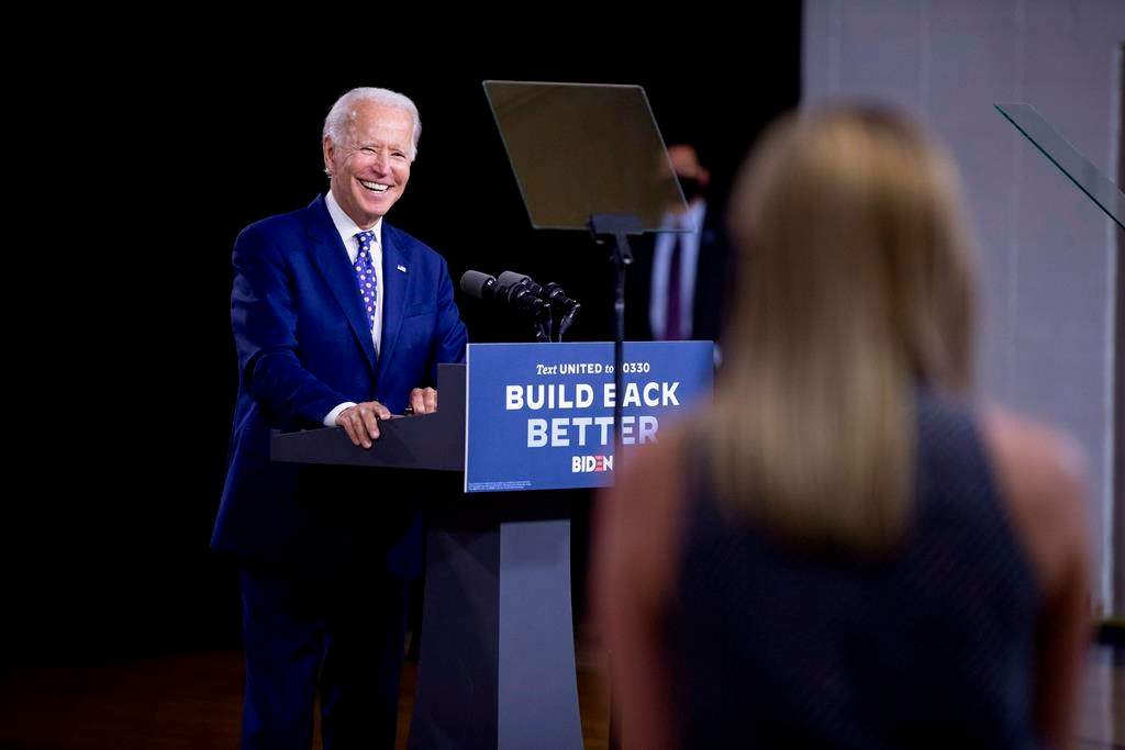 Democratic presidential candidate former Vice President Joe Biden smiles as he takes a question from a reporter at a campaign event at the William "Hicks" Anderson Community Center in Wilmington, Del., Tuesday, July 28, 2020.