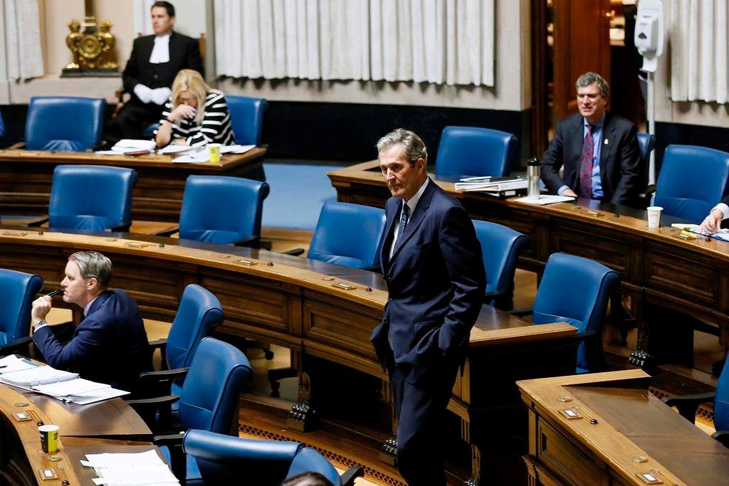 Manitoba Premier Brian Pallister makes his way to his seat during question period. 