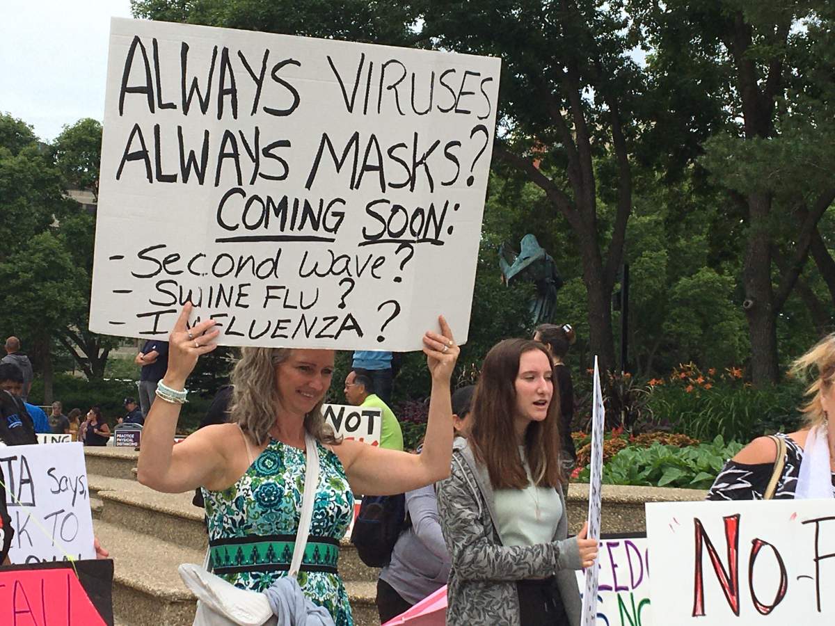 Anti-mask protesters are seen in Edmonton on July 19, 2020.