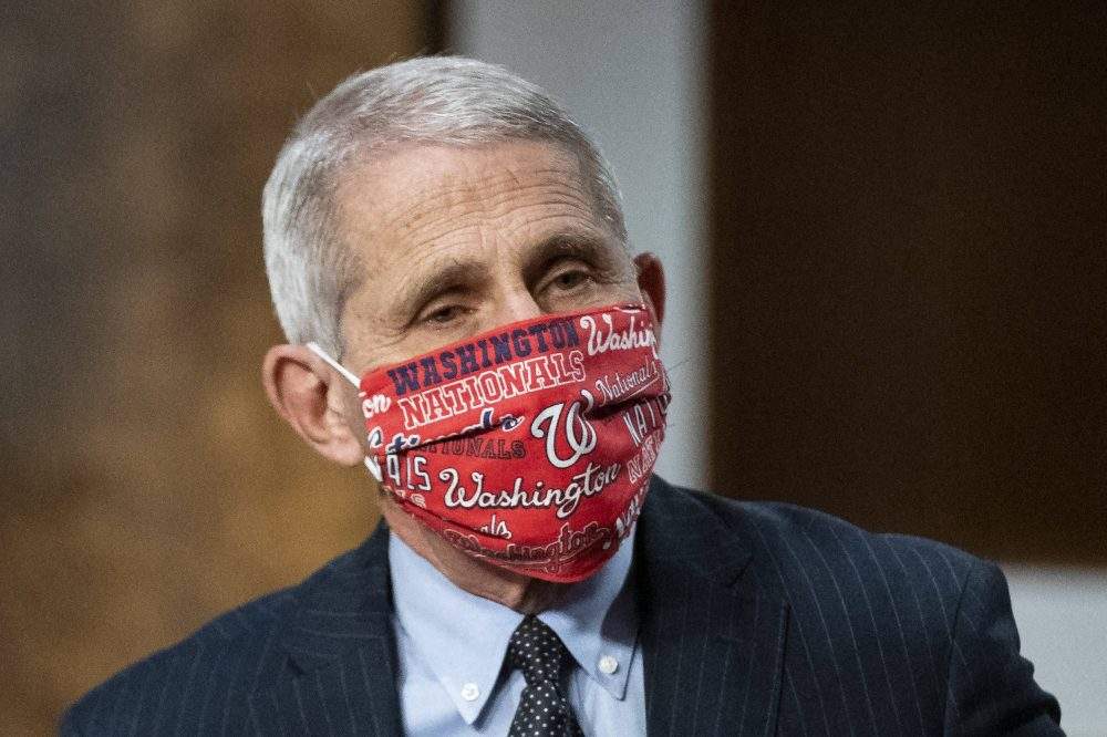 Anthony Fauci, director of the National Institute of Allergy and Infectious Diseases, wears a Washington Nationals face covering as he arrives during a Senate Health, Education, Labor and Pensions Committee hearing in Washington, DC, USA on Tuesday, June 30, 2020. 