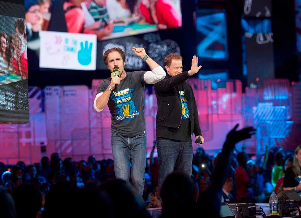 The co-founders of WE Charity are to testify before a House of Commons committee today as part of a parliamentary probe into a $912-million student-volunteer program. Craig Kielburger and Marc Kielburger speak during "We Day" in Toronto on Thursday, Oct. 2, 2014. THE CANADIAN PRESS/Hannah Yoon.