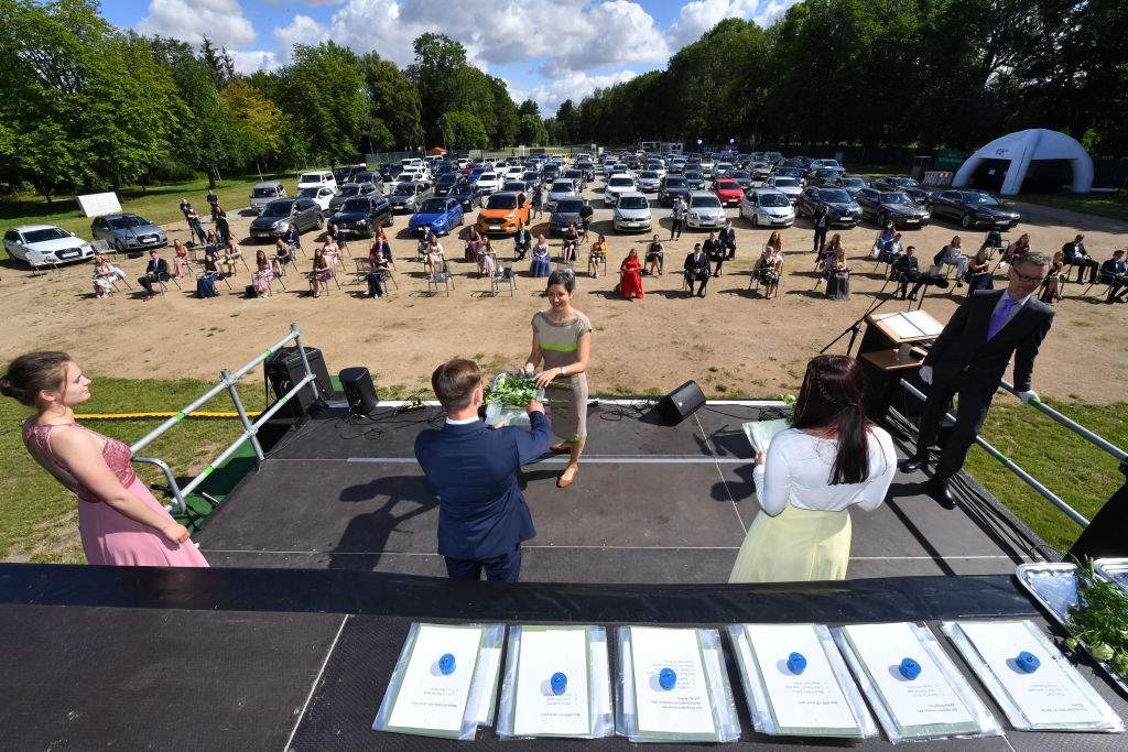 German students have a socially distanced graduation in this recent image. 