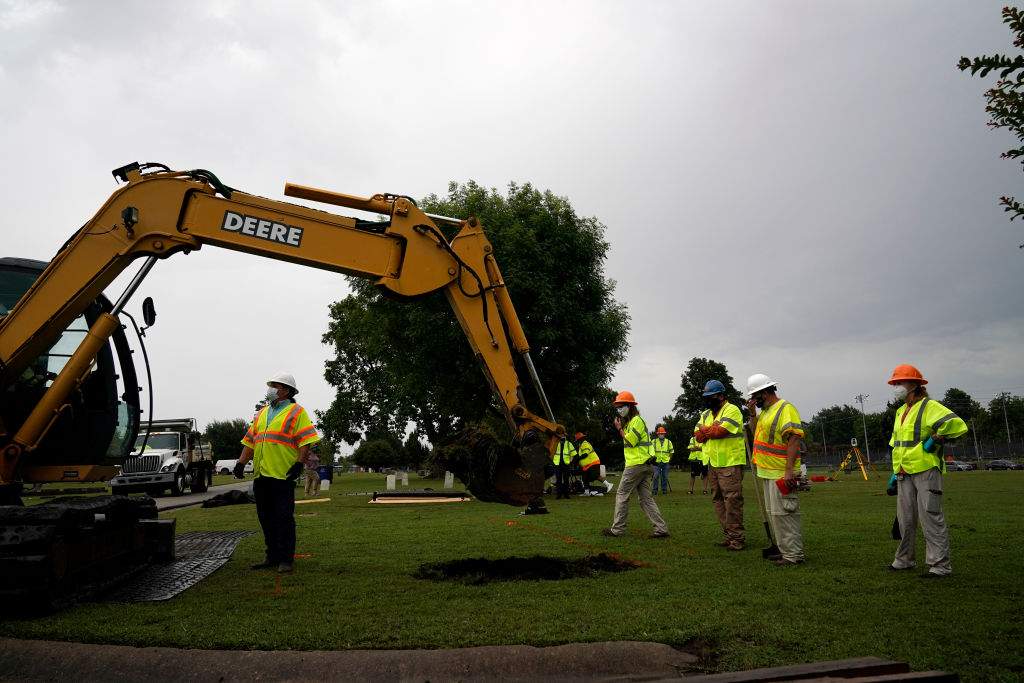 Archaeologists and observers watch during a test excavation of the 1921 Tulsa Race Massacre Graves at Oaklawn Cemetery in Tulsa, Okla., on July 13, 2020.