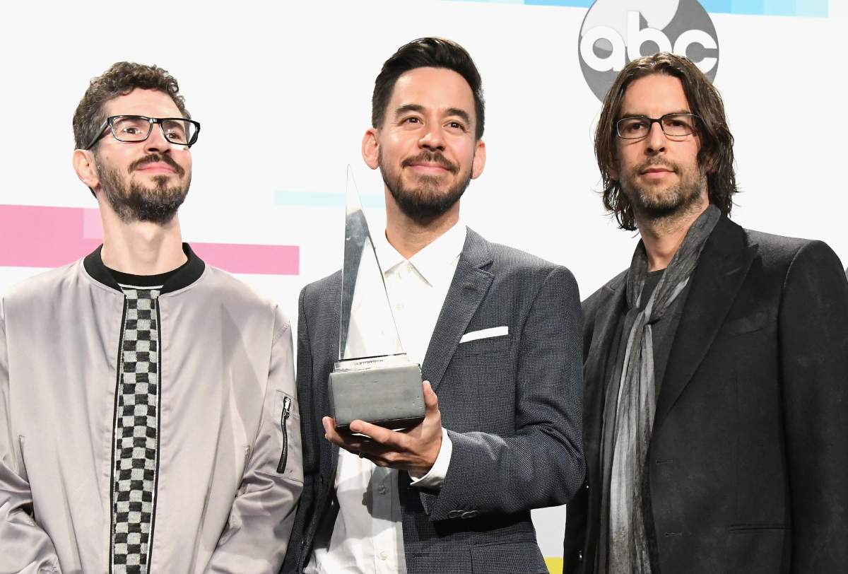 (L-R) Brad Delson, Mike Shinoda and Rob Bourdon of the band Linkin Park pose in the press room during the 2017 American Music Awards at Microsoft Theater on November 19, 2017 in Los Angeles, Calif.