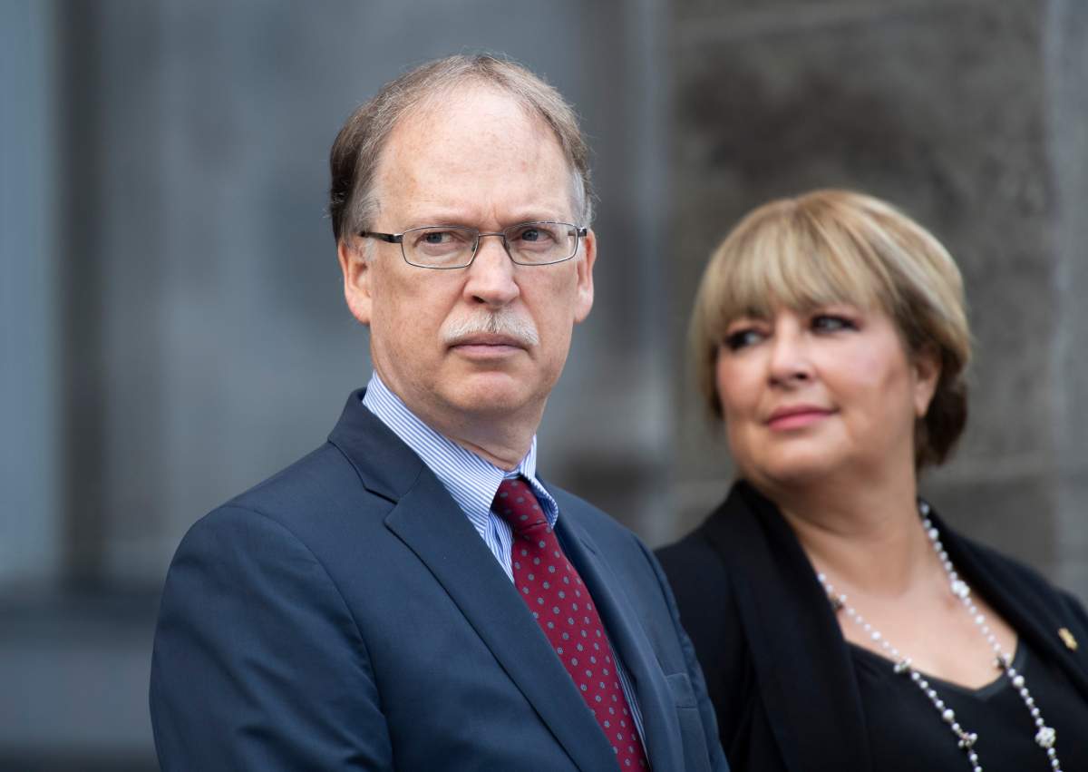 Clerk of the Privy Council Ian Shugart and Assunta Di Lorenzo, secretary to Governor General Julie Payette, wait for the arrival of Prime Minister Justin Trudeau, not shown, at Rideau Hall in Ottawa on Wednesday, Sept. 11, 2019. 
