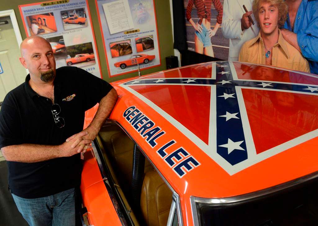 Volo Auto Museum owner and director Brian Grams poses with one of the museum’s 1969 Dodge Chargers driven in the television series ‘The Dukes of Hazzard’ in Volo, Ill., on June 26, 2015. Grams said they will continue to display the car, nicknamed “General Lee,” despite growing criticism of the Confederate battle flag painted on the car’s roof.