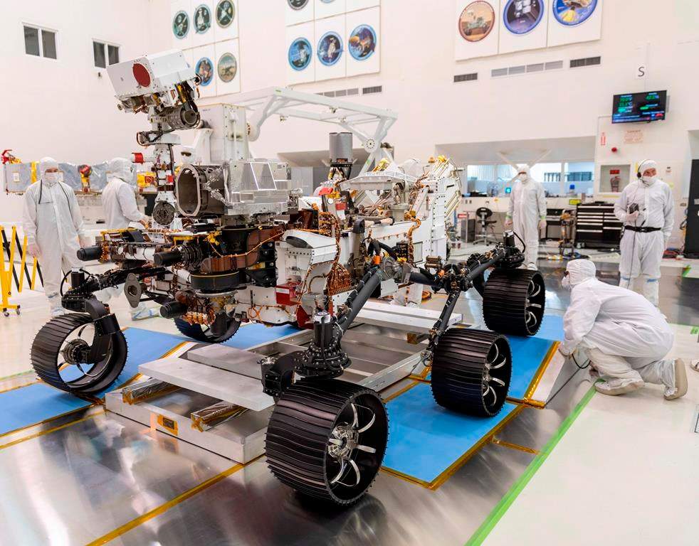 Engineers monitor a driving test for the Mars rover Perseverance in a clean room at the Jet Propulsion Laboratory in Pasadena, Calif., in this Dec. 17, 2019 photo made available by NASA. A Canadian scientist says helping NASA with a mission to Mars that will look for signs of life is the fulfillment of a childhood dream. Chris Herd of the University of Alberta is one of the advisors on a Mars probe that will pick up rocks on the red planet, study them, then seal them away to be picked up on a later mission. Herd says Perseverance, the latest Mars rover, is being sent to an ancient lake bed on the theory that those places are most likely to contain signs of life. THE CANADIAN PRESS/AP, HO - NASA, J. Krohn *MANDATORY CREDIT*.