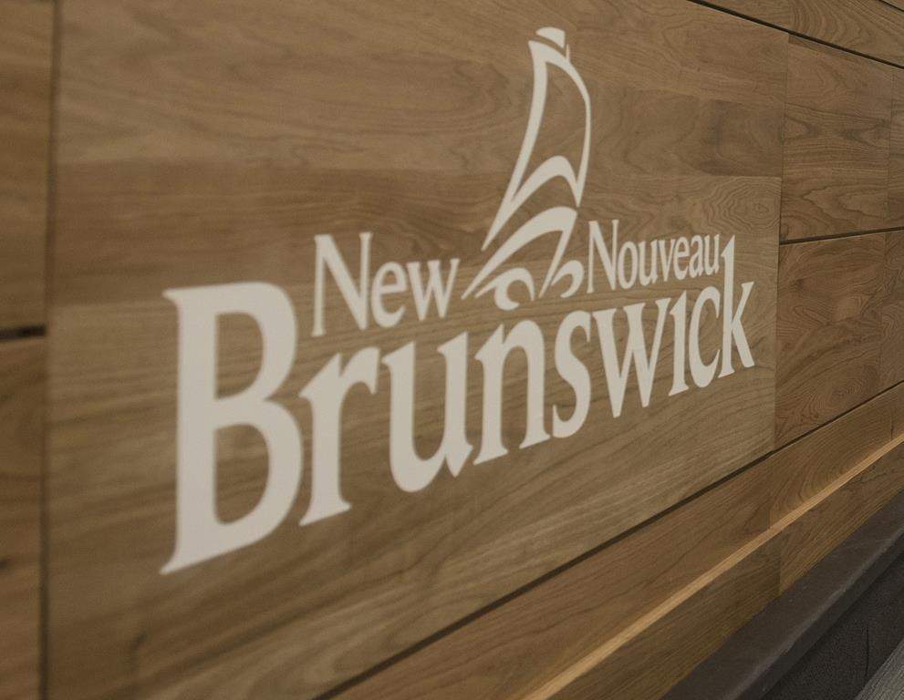 The New Brunswick logo is shown during a press conference in Fredericton, N.B., on February 17, 2020. THE CANADIAN PRESS/Stephen MacGillivray.