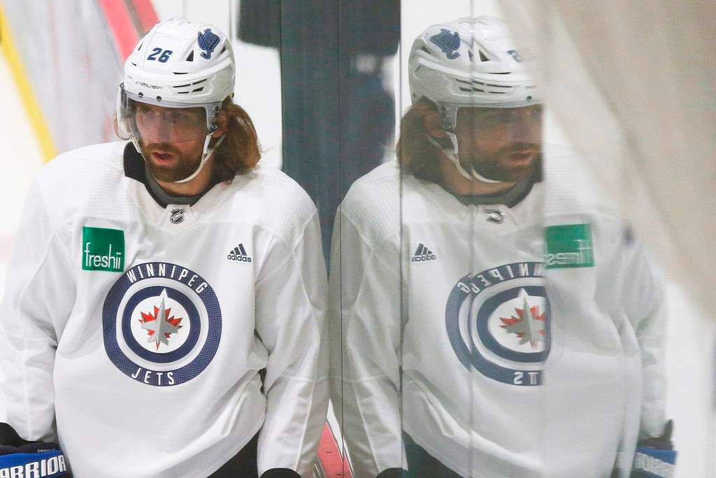 Winnipeg Jets' Blake Wheeler (26) looks on during the first day of the Jets NHL summer training camp as the NHL reopens during COVID-19 in Winnipeg, Monday, July 13, 2020.