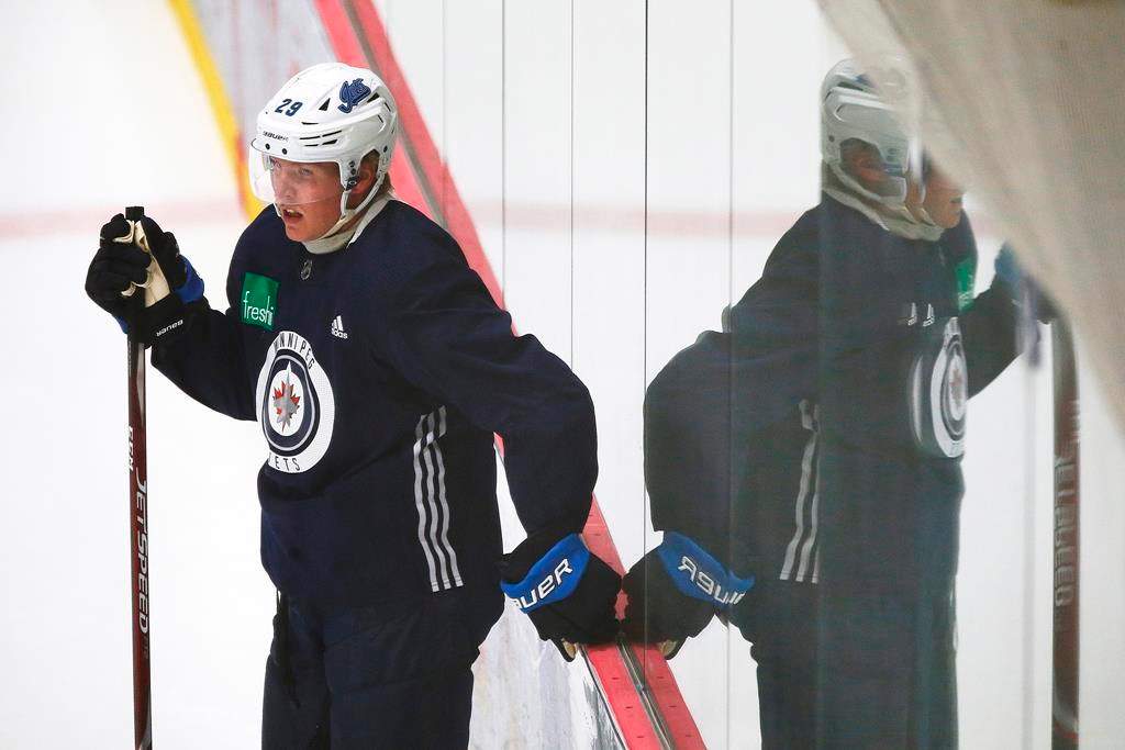 The Winnipeg Jets' Patrik Laine (29) looks on during the first day of the Jets NHL summer training camp as the NHL reopens during the COVID-19 pandemic in Winnipeg, Monday, July 13, 2020.