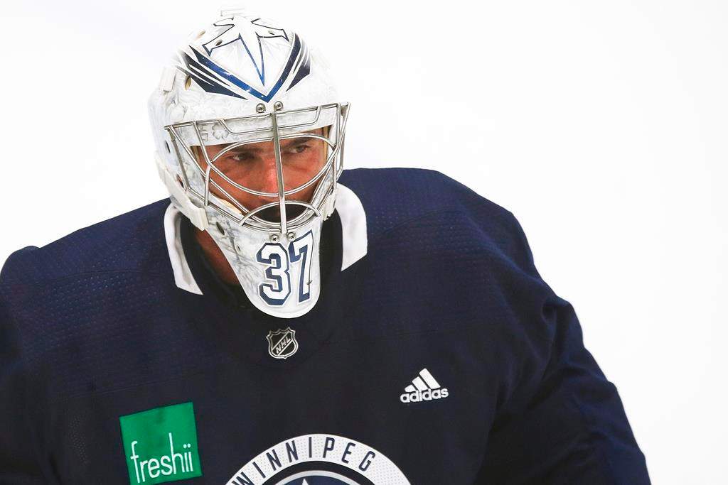 Winnipeg Jets goaltender Connor Hellebuyck (37) at practice during their NHL summer training camp as the NHL reopens during COVID-19 in Winnipeg, Tuesday, July 14, 2020.