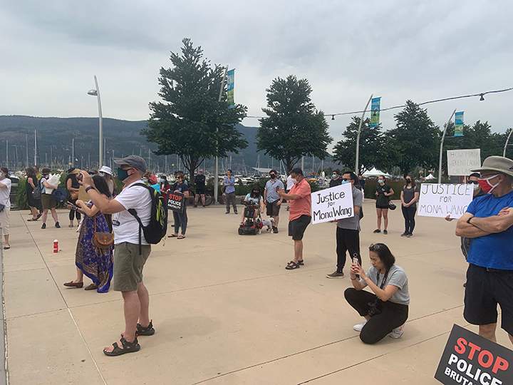 People attending a protest rally for Mona Wang in Kelowna on Saturday, July 11, 2020.