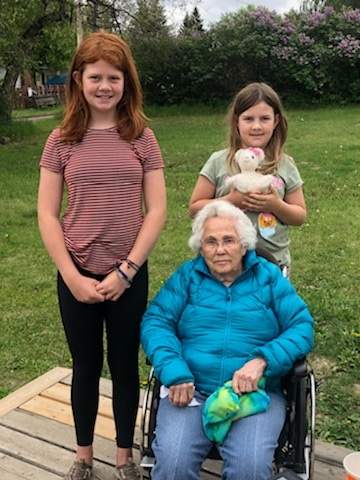 Ellen Ross, 93, is a retired nurse who is now a resident of a long-term care home. According to her family, she’s only able to wash her hands once a week due to mobility issues, and understaffing. Ross is shown above with her two great-granddaughters. (Photo courtesy of Marea Olafson)