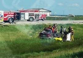 First responders at the crash site south of Letellier Friday afternoon.