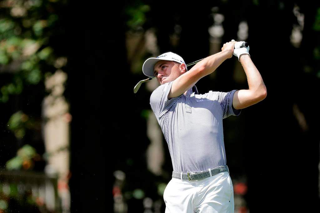 Justin Thomas hits toward the ninth green during the second round of the Memorial golf tournament, Friday, July 17, 2020, in Dublin, Ohio. (AP Photo/Darron Cummings).
