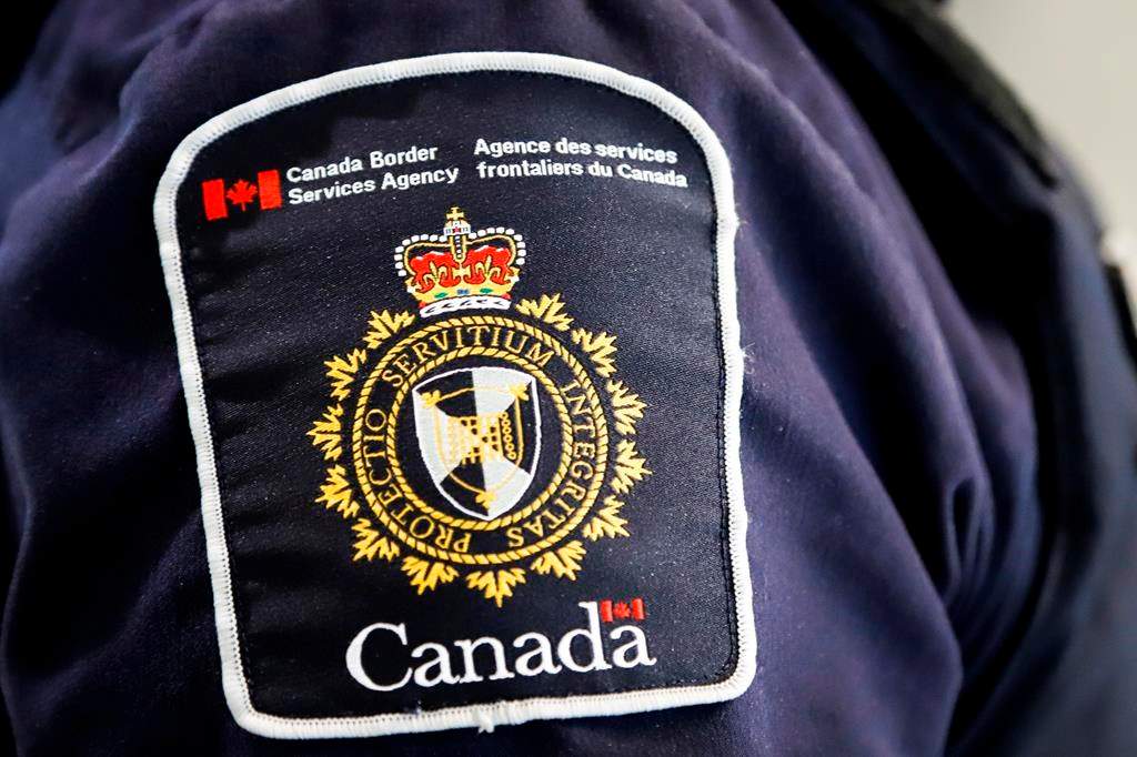 A Canada Border Services Agency (CBSA) patch is seen on an officer in Calgary, Alta., Thursday, Aug. 1, 2019.
