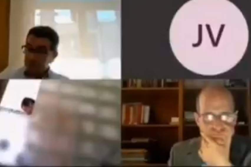 Bernardo Bustillo, bottom left, is shown in the shower during an online meeting of city officials in Torrelavega, Spain.