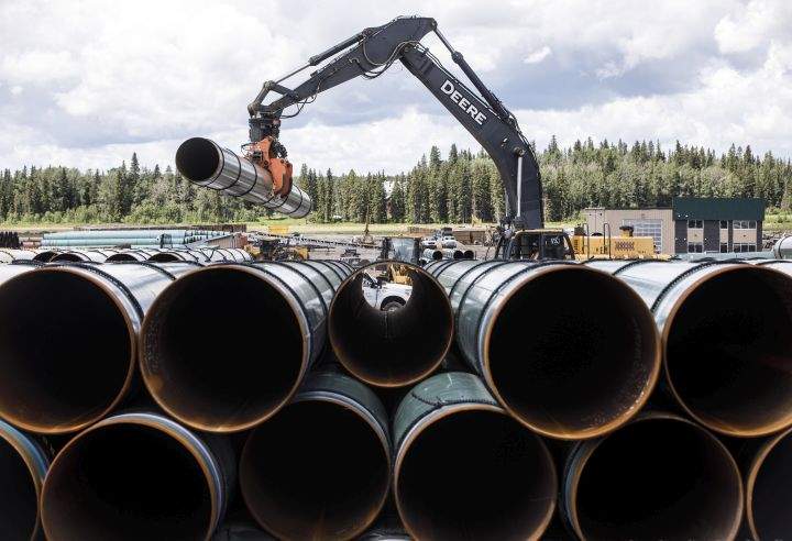 Pipe for the Trans Mountain pipeline is unloaded in Edson, Alta. on Tuesday June 18, 2019.
