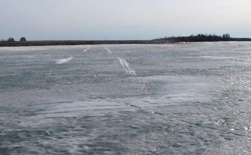 Skid marks on a frozen lake where a plane was forced to make an emergency landing near Gillam, Manitoba in April, 2019.