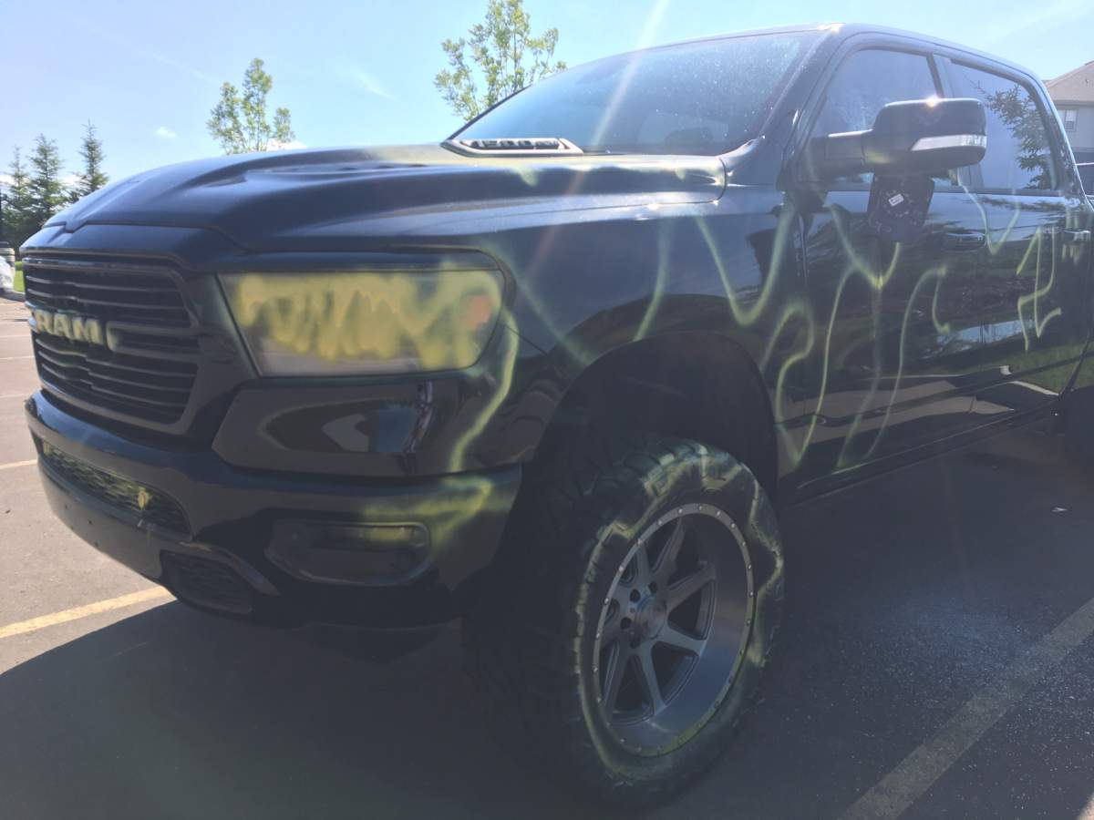 Vehicles were vandalized with yellow spray paint and windows were smashed in Edmonton’s Chappelle neighbourhood. Vehicle pictured Thursday, July 9, 2020.