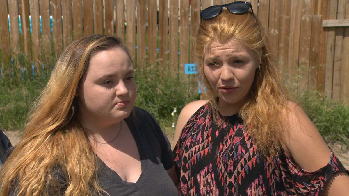 Chelsa Morrison (left) and Aubrie Grasby were two of dozens of friends who attended the vigil on Wednesday.