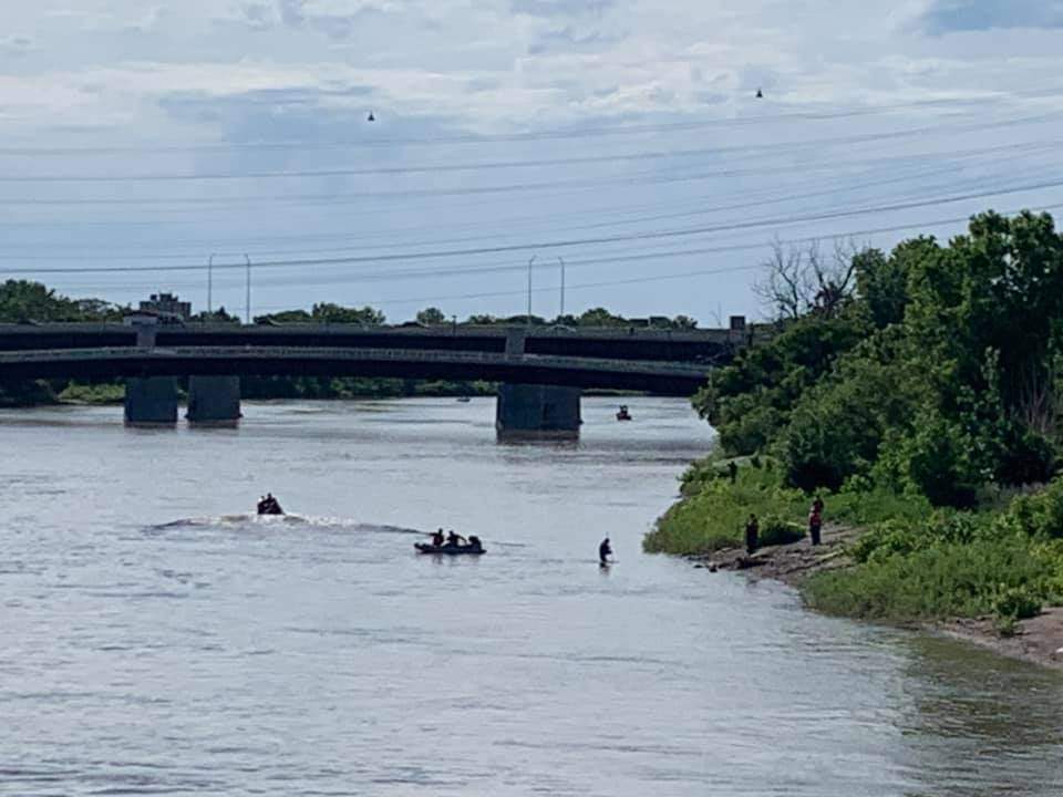 Crews search the Red River near the Louise Bridge for a missing nine-year-old boy believed to have entered the water.
