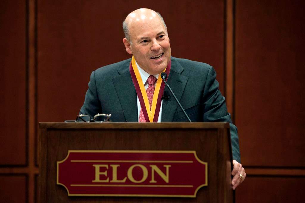 FILE - In this March 1, 2017, file photo, Elon Trustee Louis DeJoy is honored with Elon's Medal for Entrepreneurial Leadership in Elon. N.C.