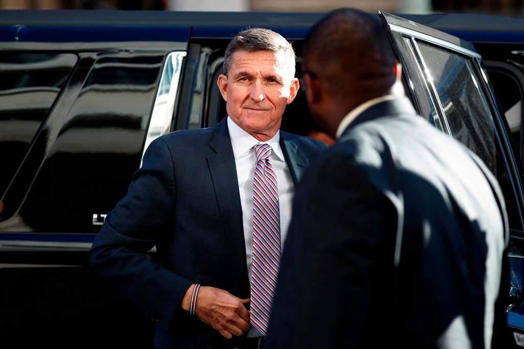 FILE - In this Dec. 18, 2018, file photo, President Donald Trump's former National Security Advisor Michael Flynn arrives at federal court in Washington.