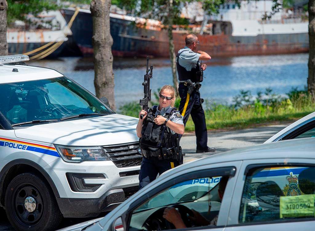 RCMP officers maintain a roadblock as they search for a suspect after a Bridgewater Police Service officer was stabbed as he responded to a domestic violence complaint at The Bridgewater Hotel in Bridgewater, N.S. on Tuesday, July 21, 2020. The search continues today around the Bridgewater, N.S., area for the man suspected of domestic assault, stabbing a police officer in the neck and later injuring a police dog.THE CANADIAN PRESS/Andrew Vaughan