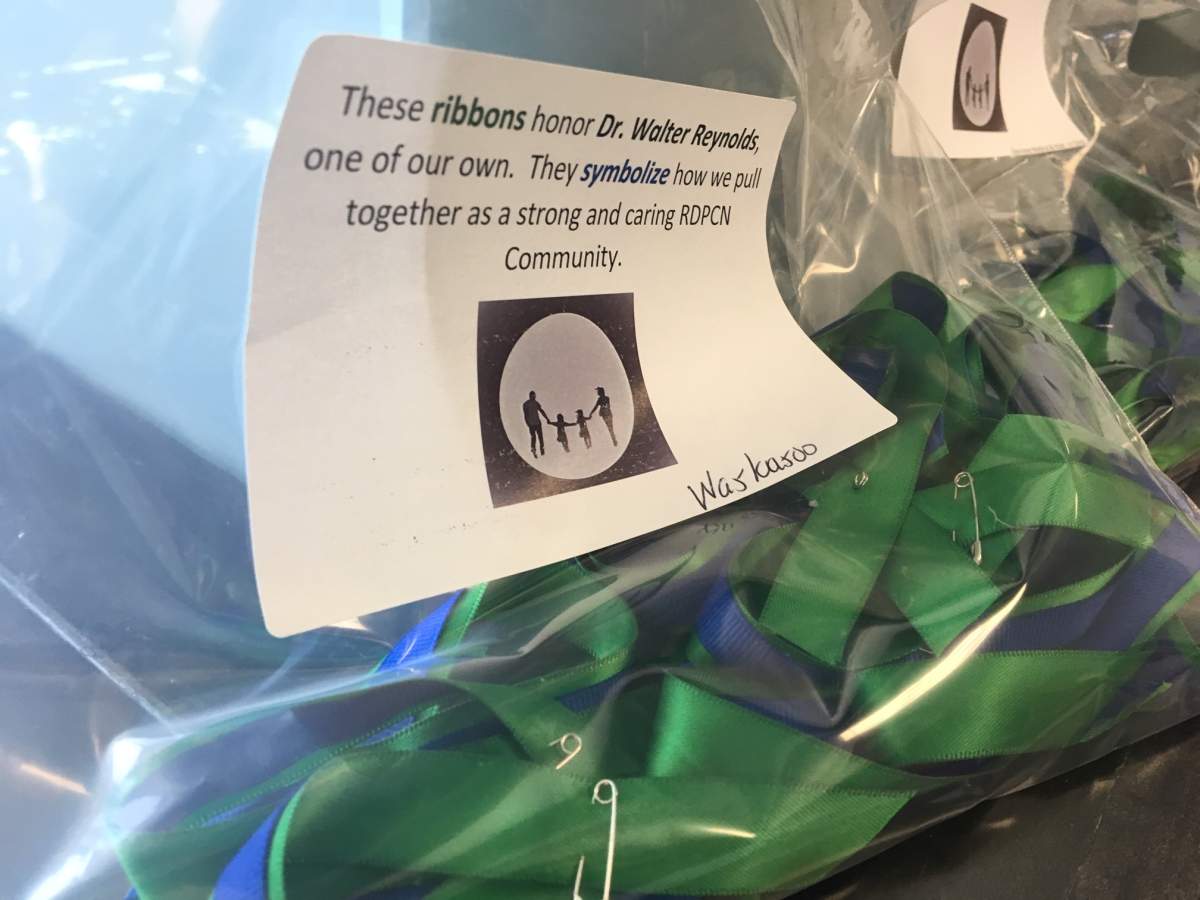 Blue and green ribbons – the colours of the Red Deer Primary Care Network – honour Dr. Reynolds.