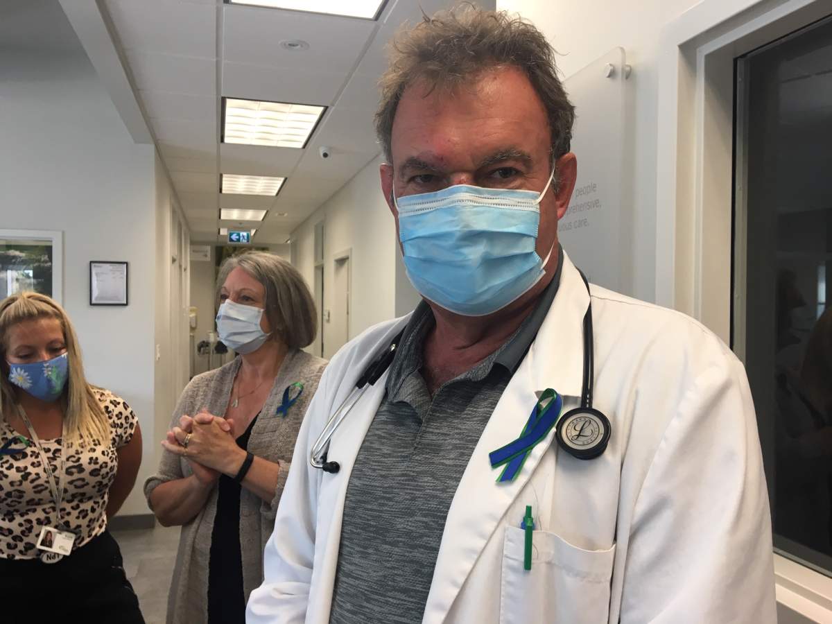 Blue and green ribbons – the colours of the Red Deer Primary Care Network – honour Dr. Reynolds.
