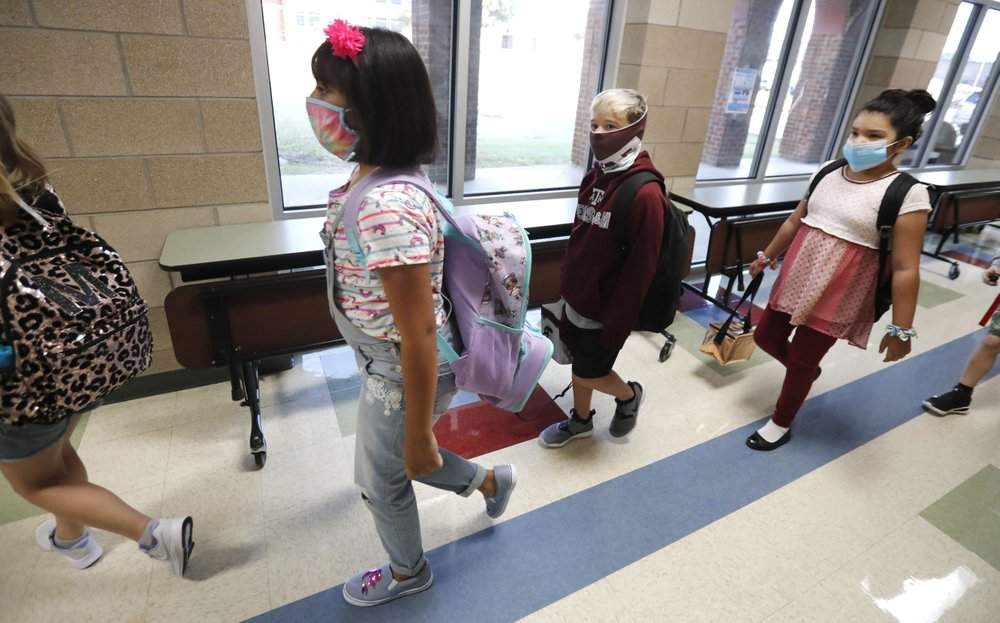 Parents are getting ready to send their kids to school with masks.