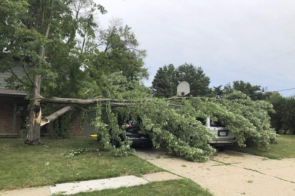 Pieces of the Buccaneer Arena roof litter the parking lot after a strong thunderstorm with high winds blew through the Des Moines metro on Monday, Aug. 10. 2020, in Urbandale, Iowa.