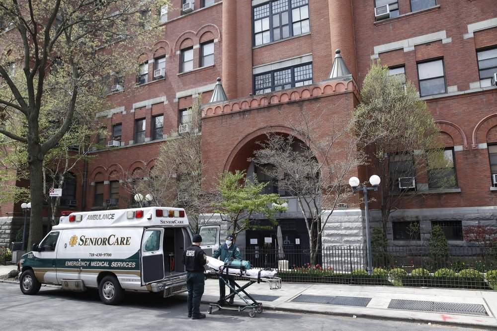 FILE – In this April 17, 2020, file photo, emergency medical workers arrive at Cobble Hill Health Center in the Brooklyn borough of New York. New York’s coronavirus death toll in nursing homes, already among the highest in the nation, could actually be a significant undercount. Unlike every other state with major outbreaks, New York only counts residents who died on nursing home property and not those who died in hospitals.