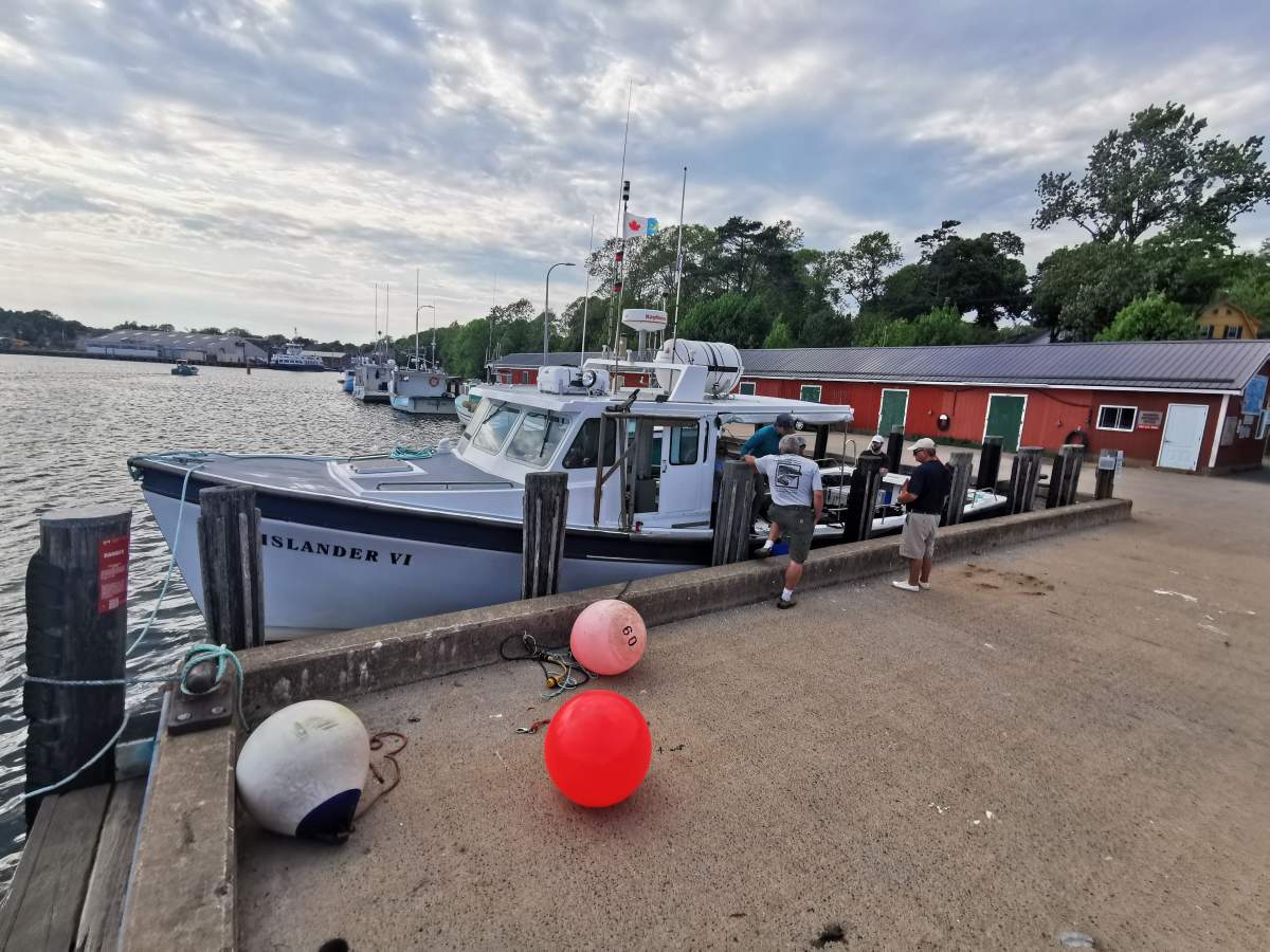The volunteer diving crew left the waterfront of Lunenburg in search of a potential area where a new artificial reef could sit on the Atlantic ocean floor.