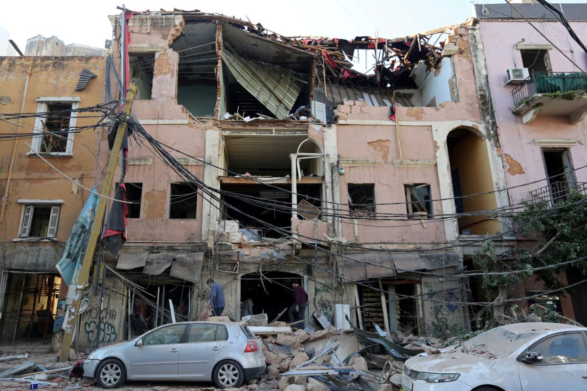Men inspect a damaged building near the site of Tuesday’s blast in Beirut’s port area, Lebanon, Aug. 5, 2020. REUTERS/Aziz Taher/File Photo