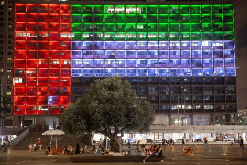 FILE - In this Aug. 13, 2020, file photo, Tel Aviv City Hall is lit up with the flag of the United Arab Emirates as UAE and Israel announced they would be establishing full diplomatic ties, in Tel Aviv, Israel.Iran’s powerful Revolutionary Guard vowed on Saturday, Aug. 15, 2020 that there would be dangerous consequences for the United Arab Emirates after it announced a historic deal with Israel to open up diplomatic relations. 
