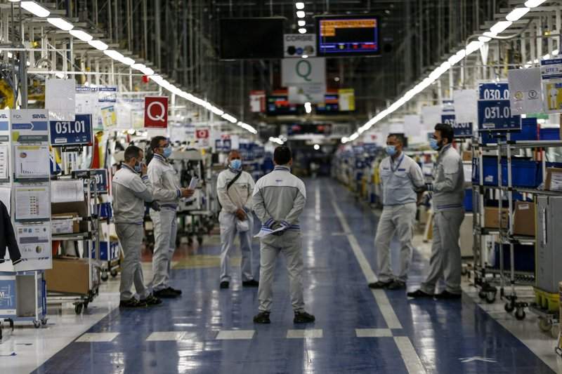 FILE - Managers inform small groups of workers about new safety devices and measures taken at the Fiat Chrysler Automobiles plants of Atessa, in Central Italy, in a Monday, April 27, 2020 file photo. General Motors is asking a federal judge to reconsider dismissal of a lawsuit against Fiat Chrysler based on new allegations that FCA bribed union and GM officials with millions stashed in secret foreign bank accounts. The allegations were made in a court motion filed Monday, Aug. 3, 2020 by GM. 