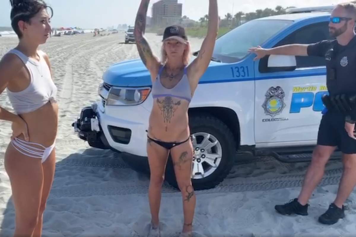 Sam Panda, centre, and her friend, left, were told their outfits violated public decency rules at the beach in South Carolina on Aug. 2, 2020.