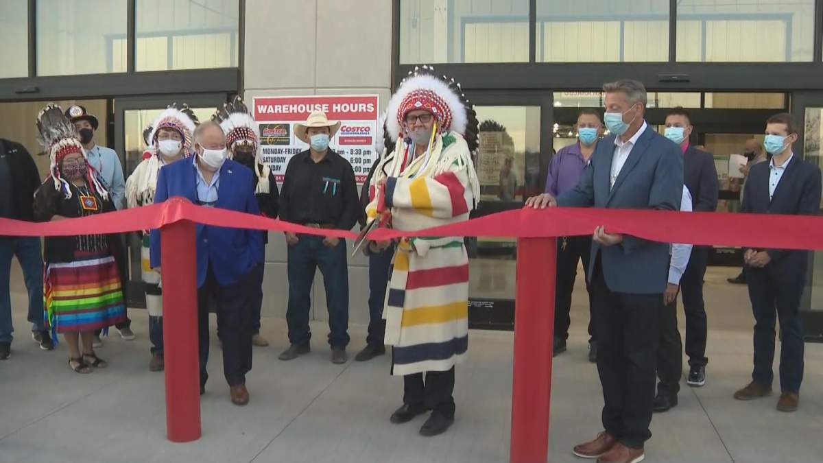 Tsuut’ina Chief Roy Whitney cuts a ribbon at the grand opening of the Southwest Calgary Costco located at The Shops at Buffalo Run.