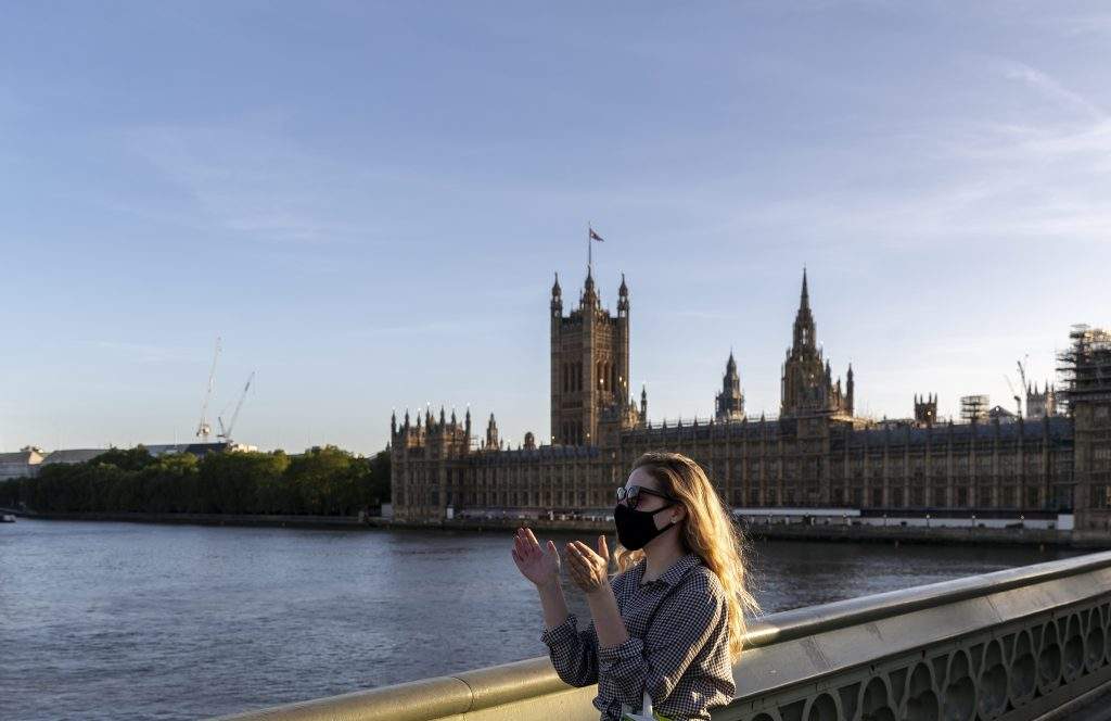 LONDON, May 29, 2020  A woman wearing a face mask takes part in the weekly ''Clap for our Carers'' for the last time in front of the Houses of Parliament in London, Britain, on May 28, 2020.