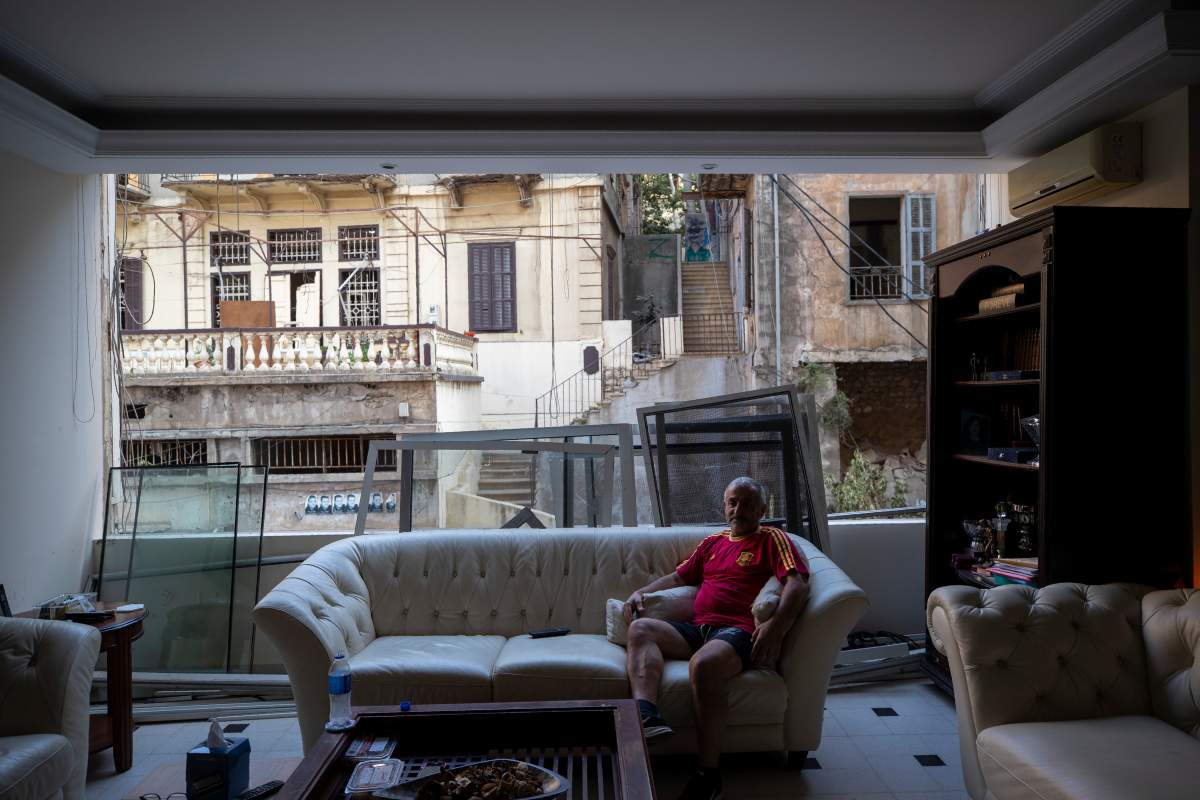George Abdo, 58, poses for a photograph inside his destroyed apartment after Tuesday’s explosion in the seaport of Beirut, Lebanon, Aug. 6, 2020.