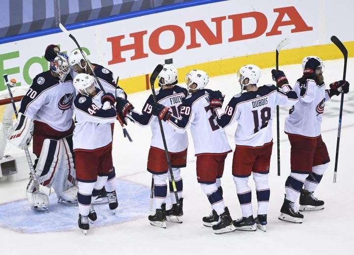 Columbus Blue Jackets goaltender Joonas Korpisalo (70) celebrates his shutout win with teammates after eliminating the Toronto Maple Leafs during third period NHL Eastern Conference Stanley Cup playoff action in Toronto on Sunday, August 9, 2020. 