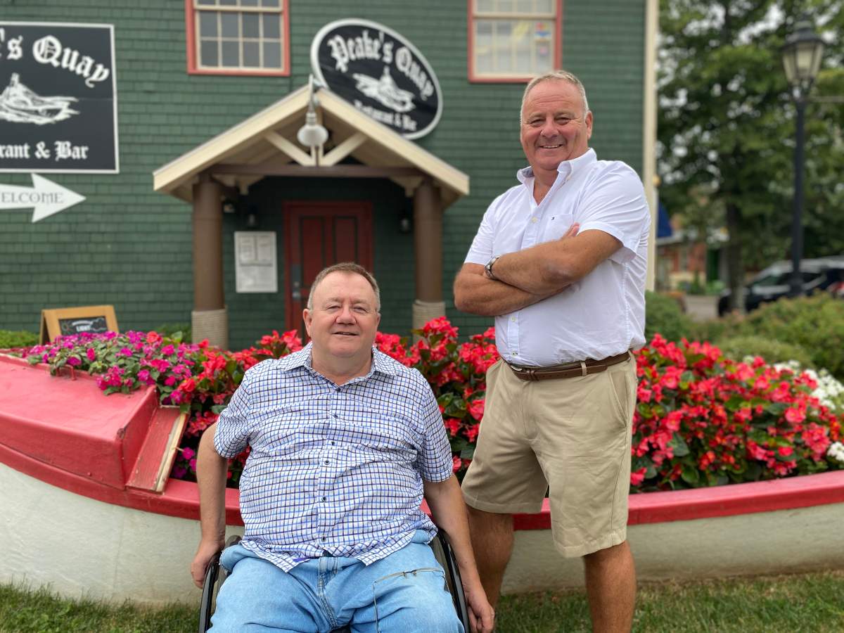 Brothers Tony and Liam Dolan pose in this undated handout photo. A nature reserve in Prince Edward Island is expanding through a land donation to the Nature Conservancy of Canada.