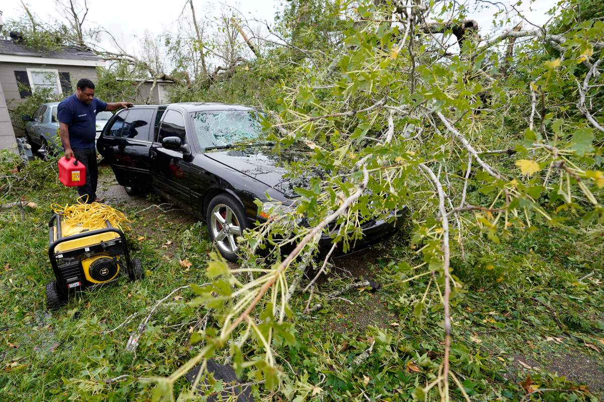 Reginald Duhon prepares to work at his home on Thursday, Aug. 27, 2020, in Lake Charles, La., after hurricane Laura moved through the state.